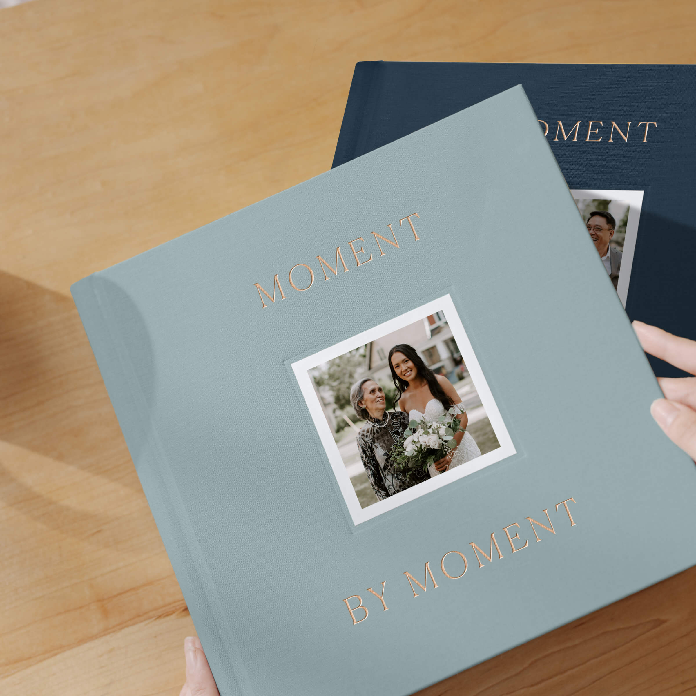 Multiple wedding photo books in different colors