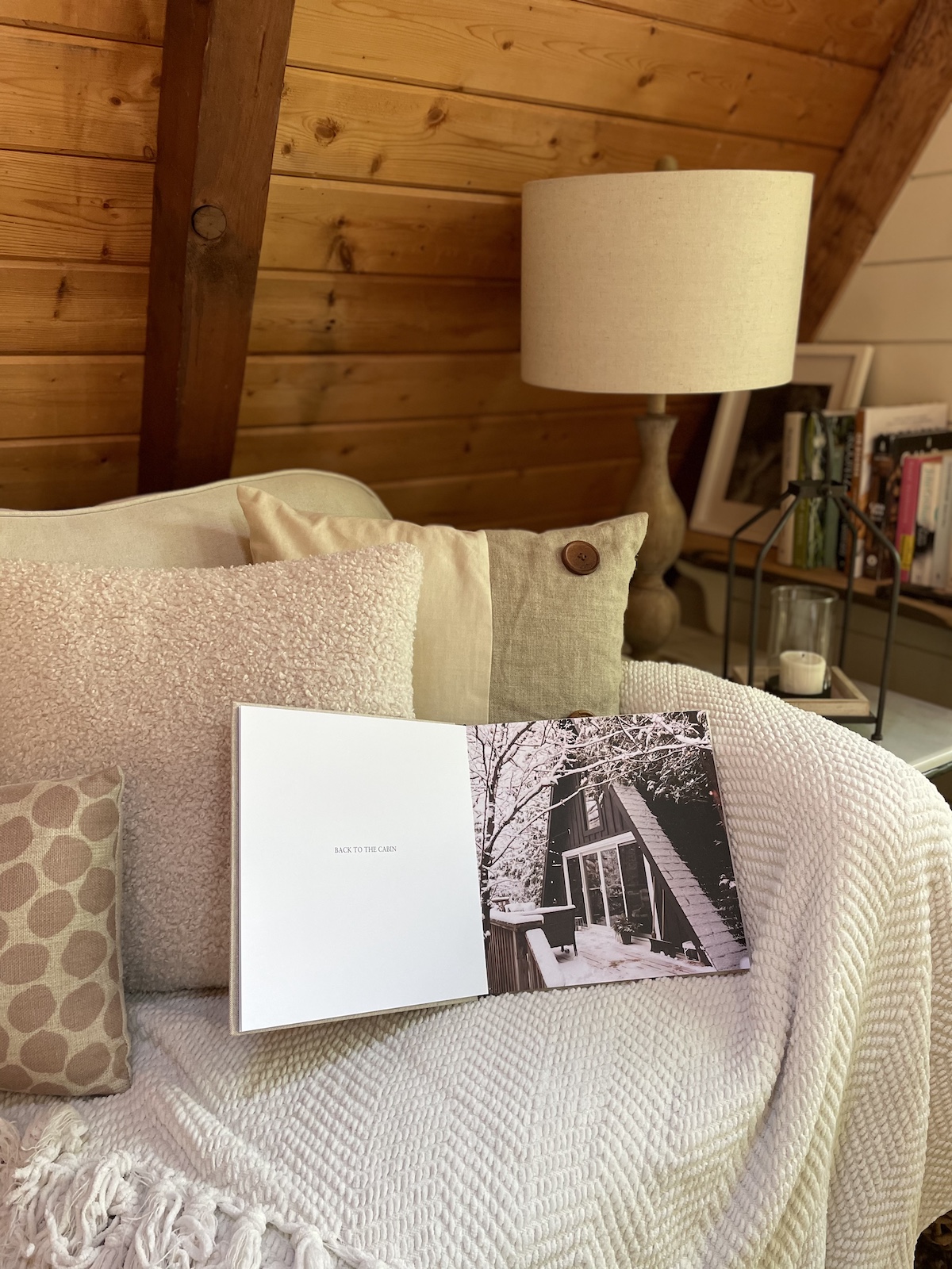 Photo book of a cabin, open on a chair