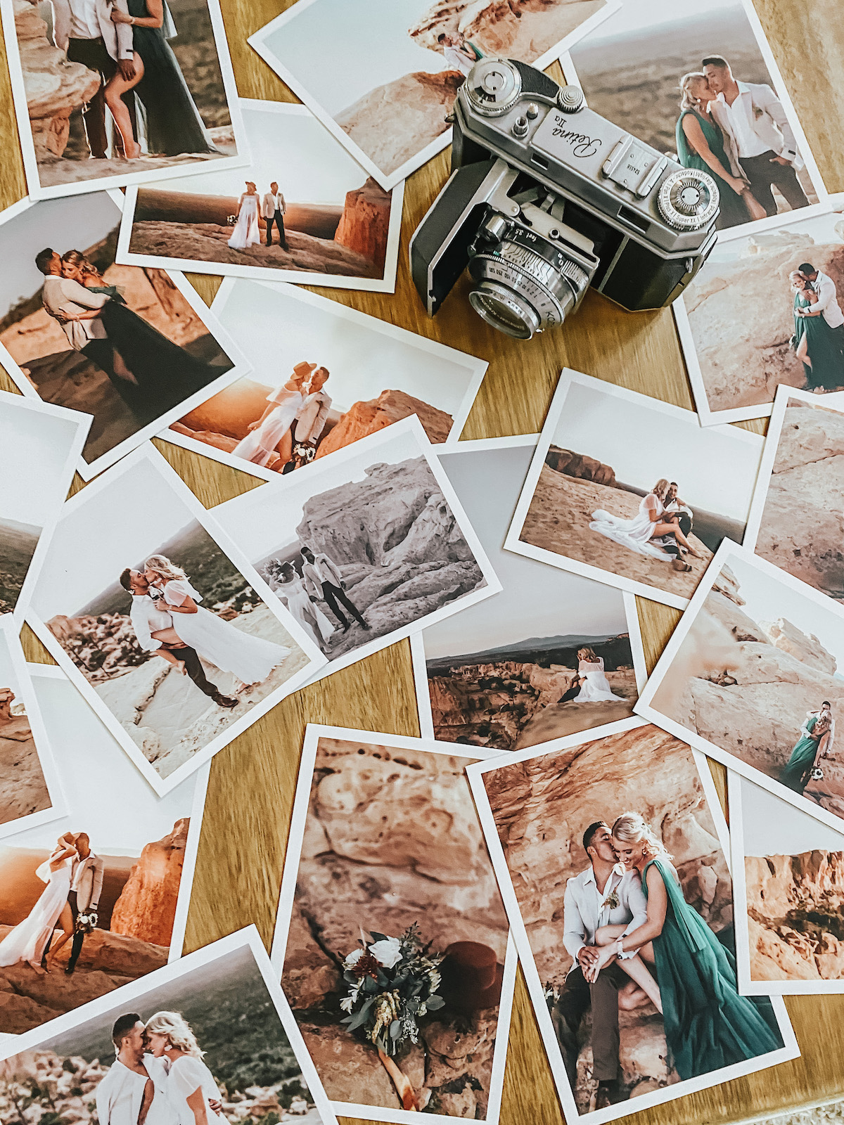 Photo prints of a man and woman spread out on table