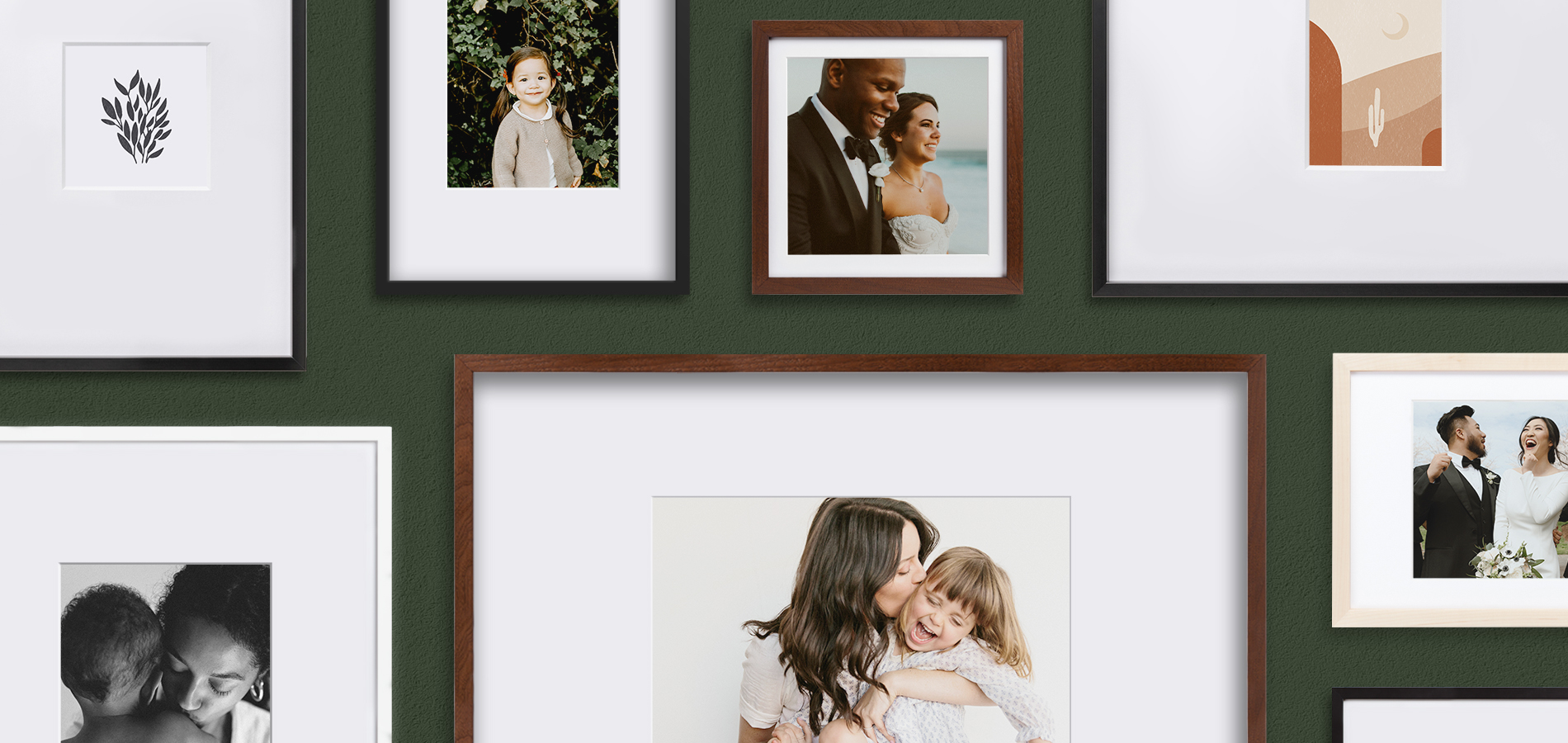 Gallery wall of Artifact Uprising frames featuring a variety of photos and mat sizes