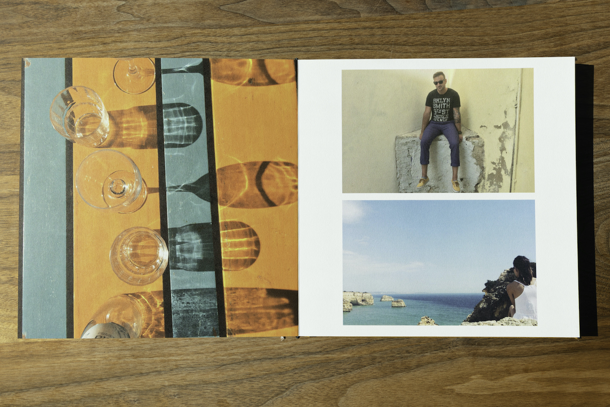 Artifact Uprising Layflat Photo Album opened to spread of colorful travel photos
