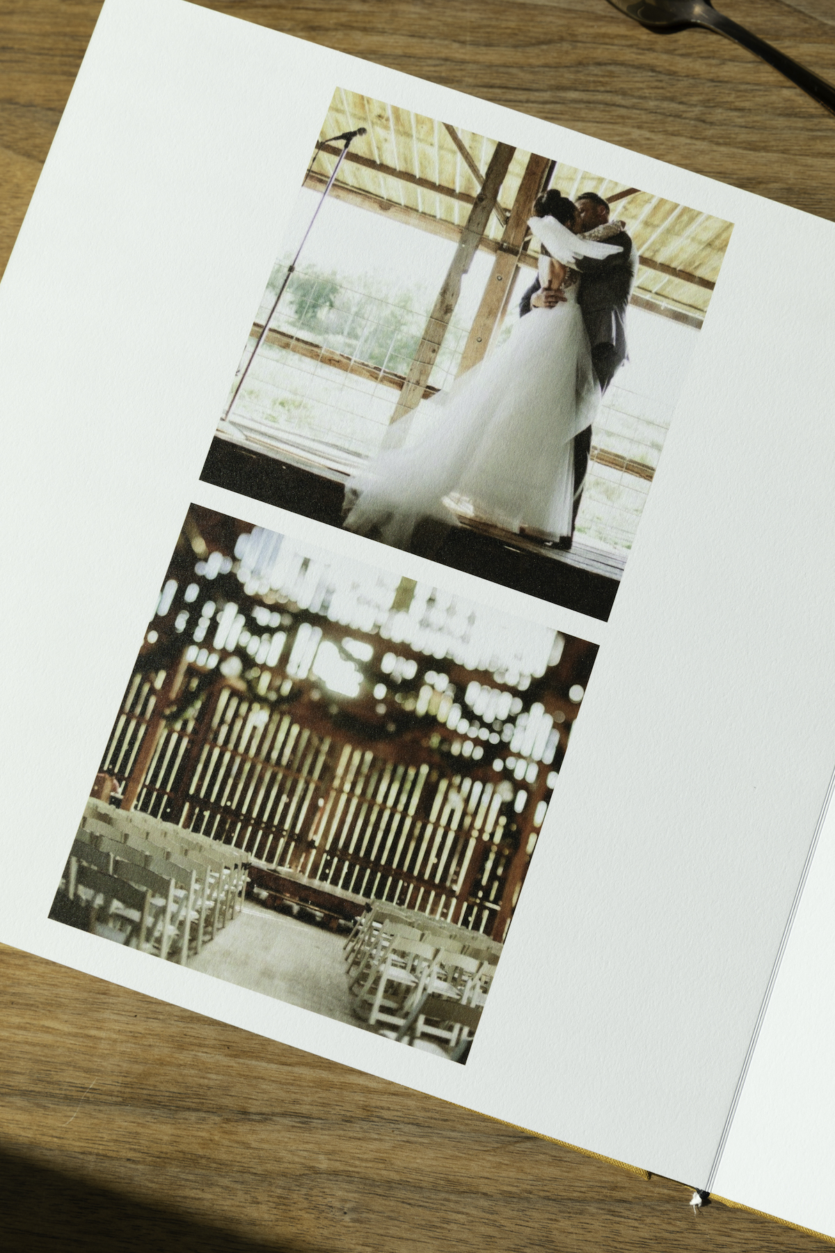 Artifact Uprising Layflat Photo Album opened to wedding photos on left page