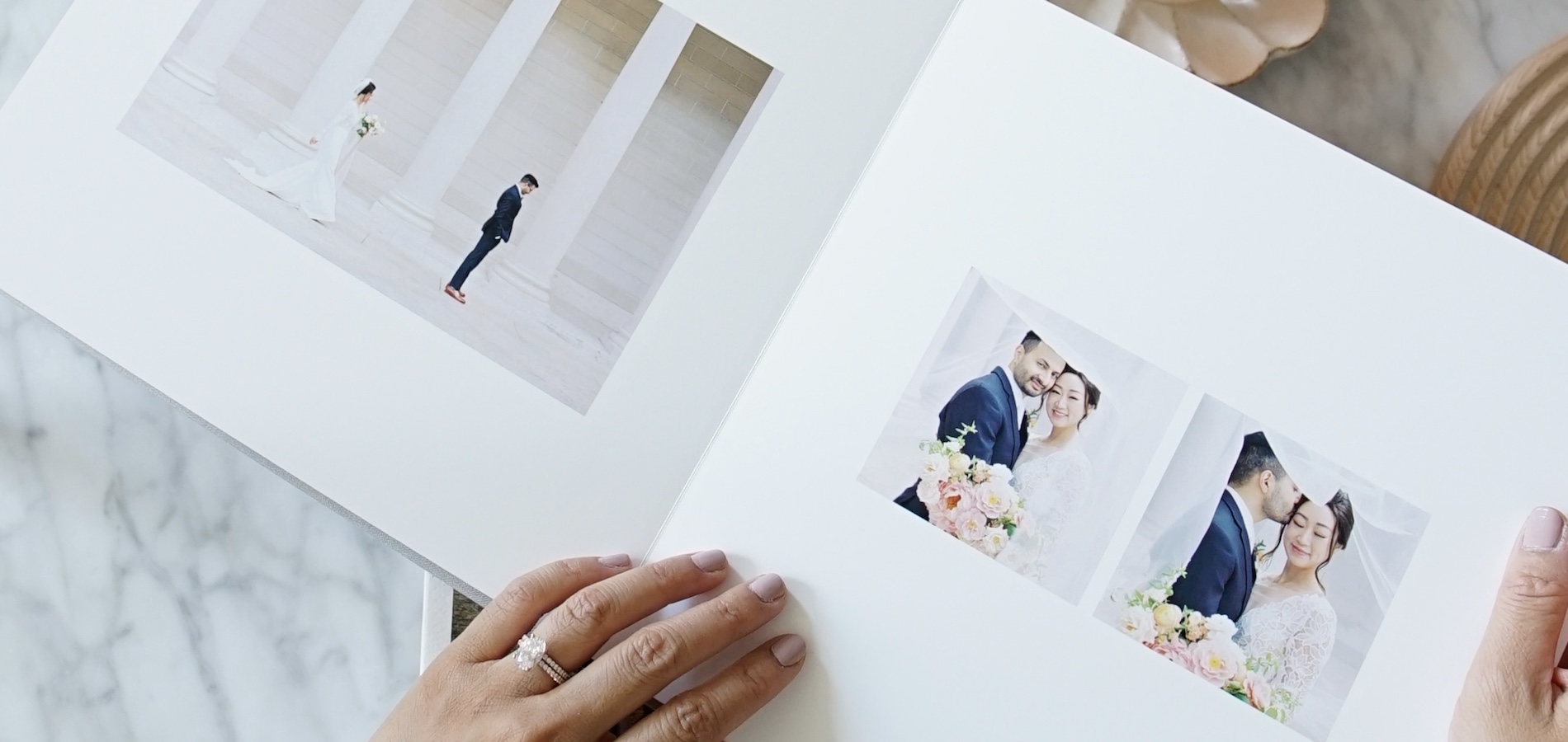 Zoomed in on interior of Artifact Uprising Layflat Photo Album featuring wedding portraits with lots of negative space on page